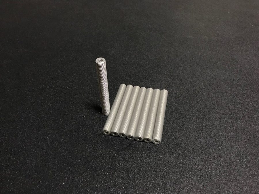 CNC turned part with threaded features