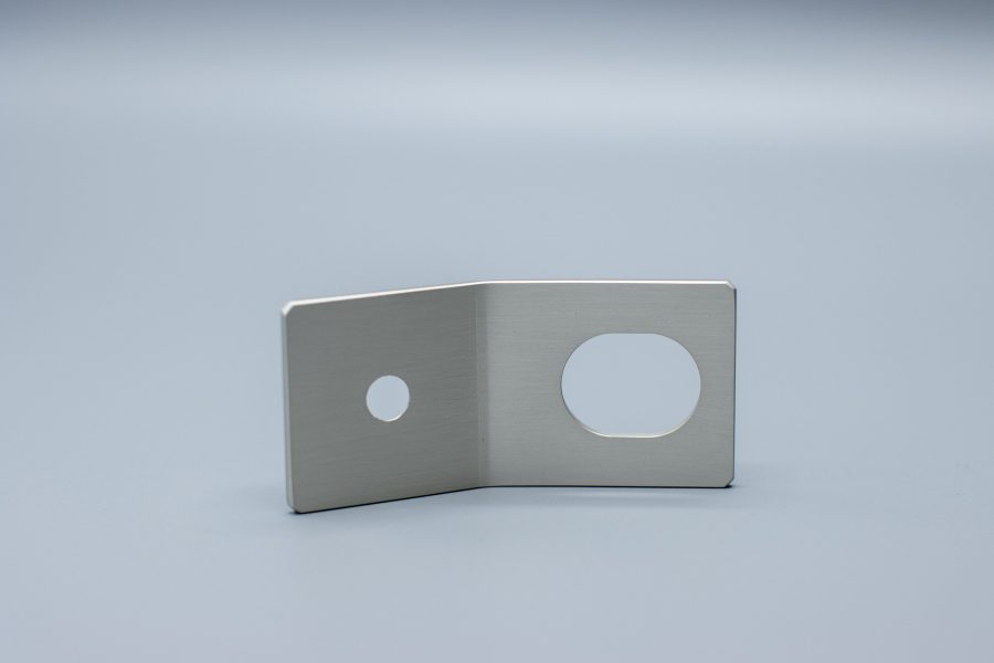 Machined part with tight tolerance features